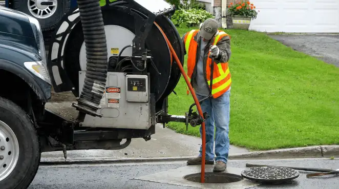 Technician using specialized drainage equipment for sewer line cleaning and foundation protection in Charleston, SC
